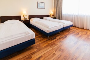 Triple Room | Minibar, in-room safe, desk, soundproofing