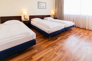 Triple Room | Minibar, in-room safe, desk, soundproofing