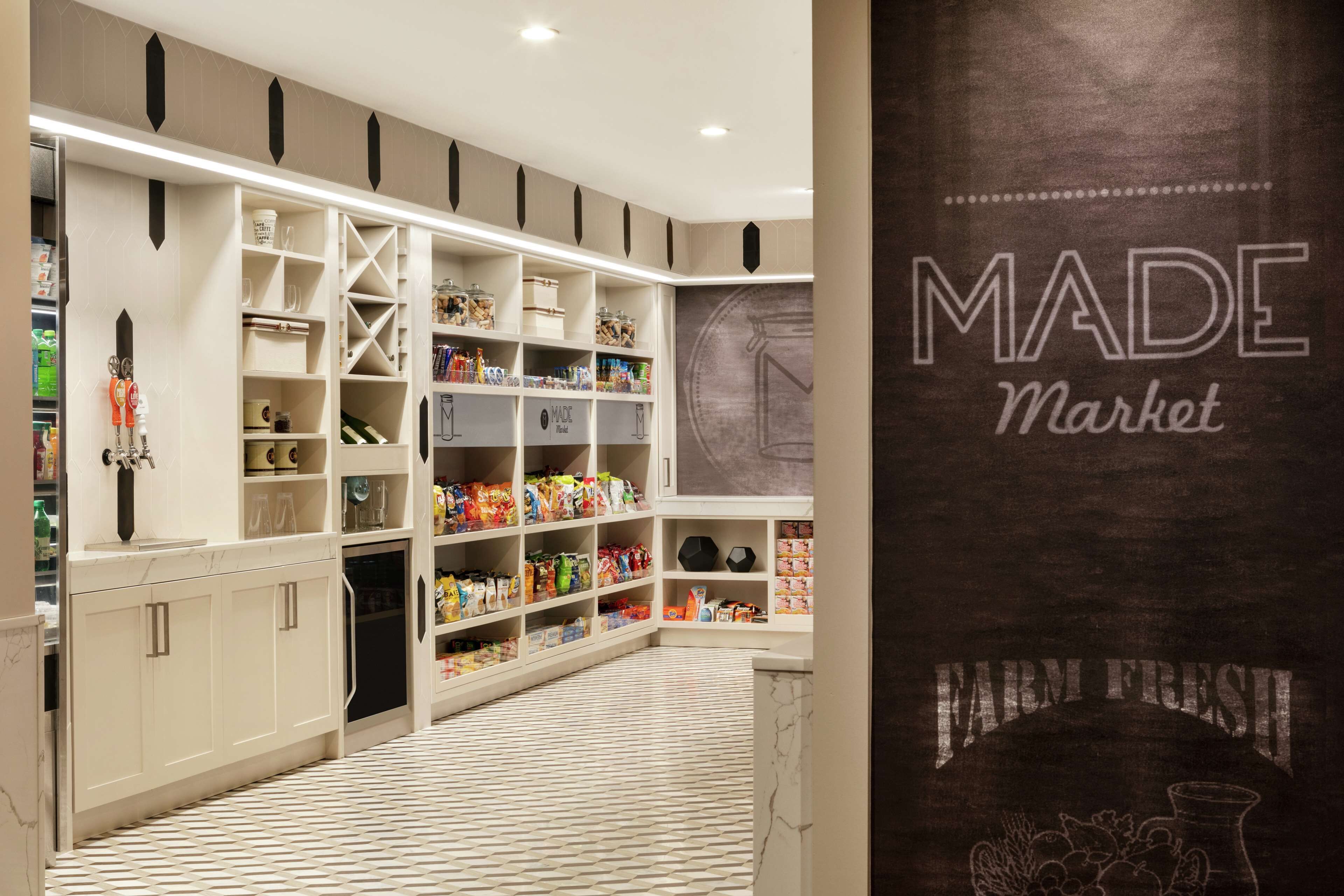 A well-organized pantry with various food items and storage shelves.