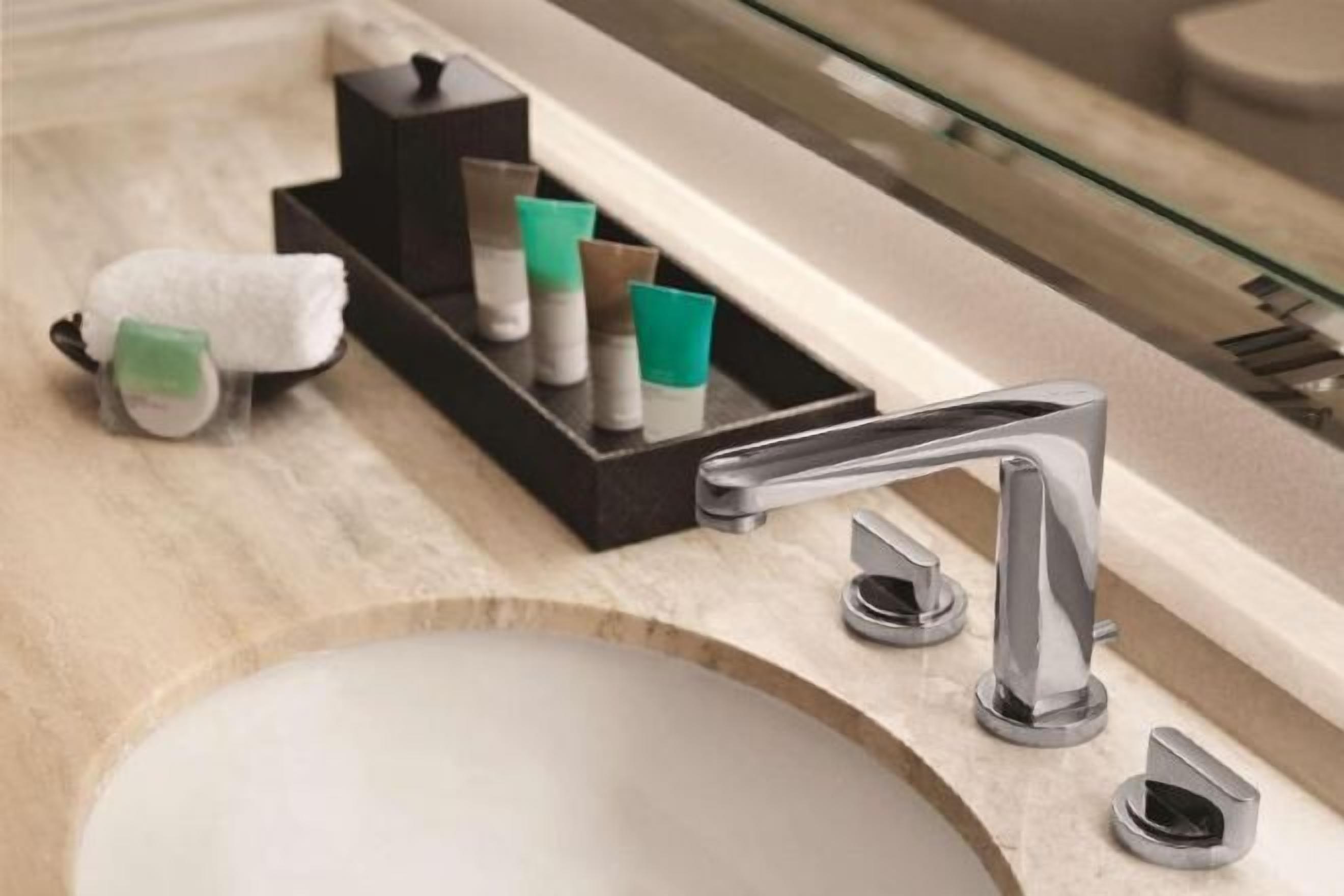 Designer toiletries, hair dryer, bathrobes, towels