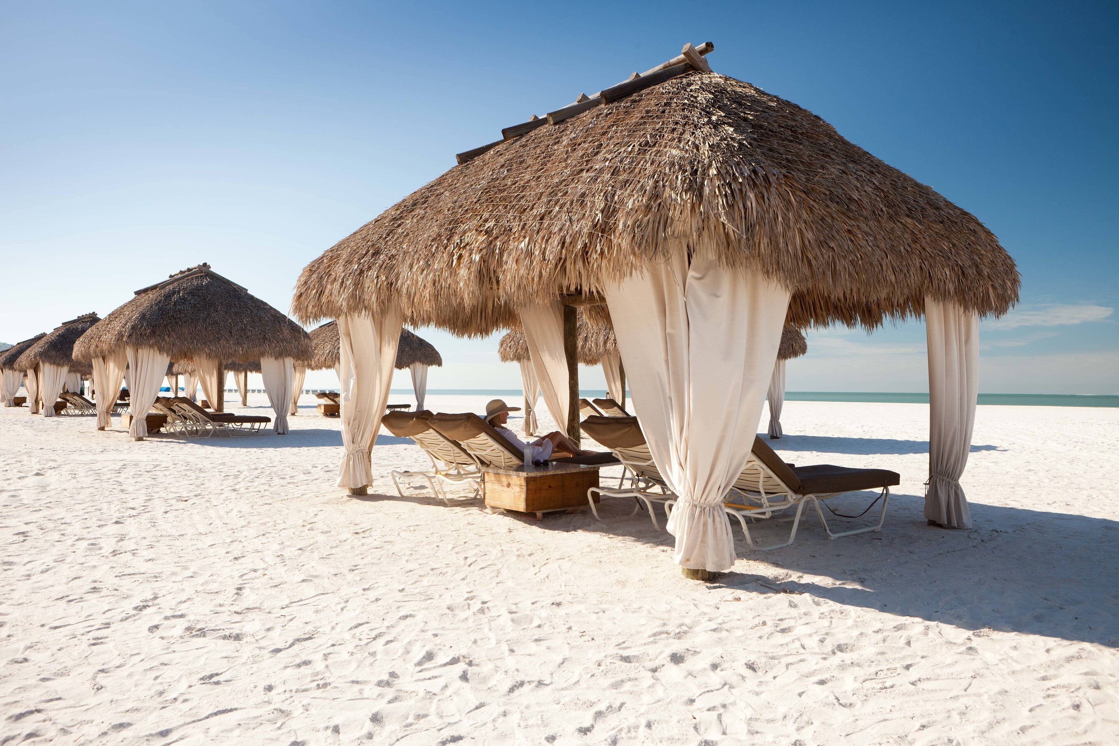 On the beach, beach cabanas, sun loungers, beach umbrellas