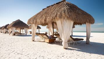 On the beach, beach cabanas, sun loungers, beach umbrellas
