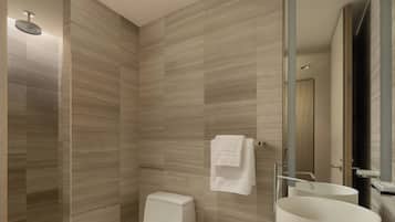 A modern bathroom with a shower, toilet, and two sinks.