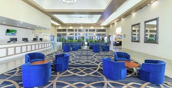 Sitting area in hotel lobby at Alexis Park All Suite Resort