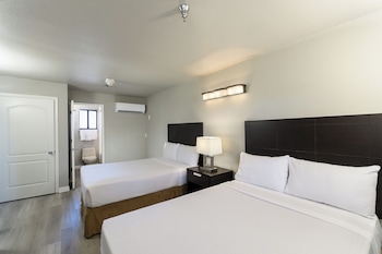 2 Double Beds Extended Stay | 1 bedroom, desk, iron/ironing board, free cribs/infant beds at Alexis Park All Suite Resort