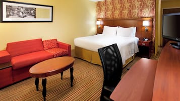 Premium bedding, desk, laptop workspace, blackout drapes