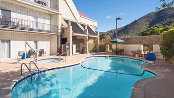 Outdoor pool, open 6:00 AM to 10:00 PM, pool loungers