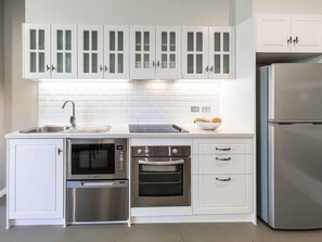 Apartment, 1 Bedroom | Premium bedding, in-room safe, laptop workspace, iron/ironing board