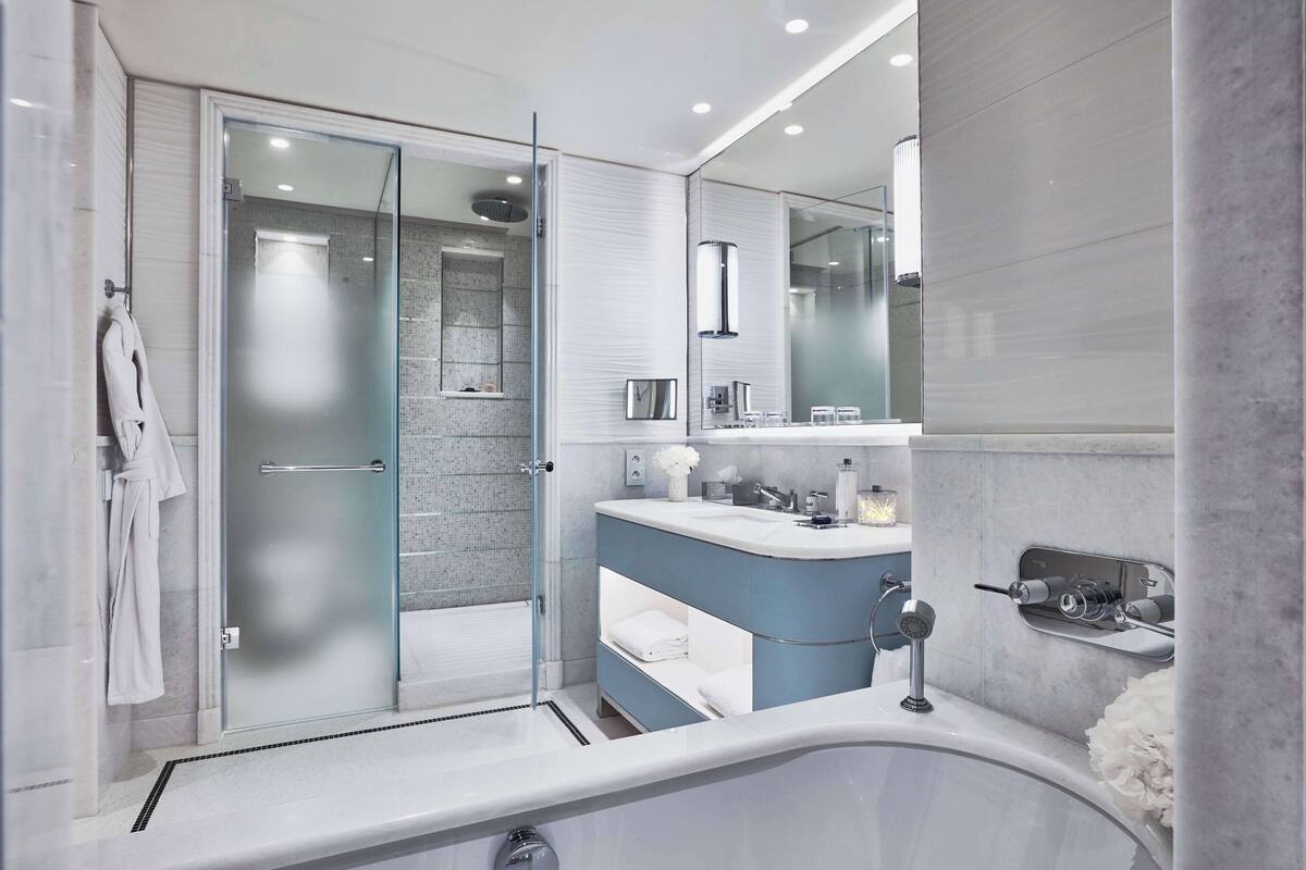 Designer toiletries, hair dryer, bathrobes, slippers