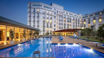 Outdoor pool, open 7:00 AM to 8:00 PM, pool umbrellas, pool loungers