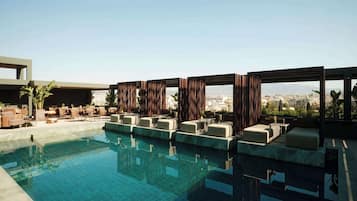 Seasonal outdoor pool, pool umbrellas, pool loungers