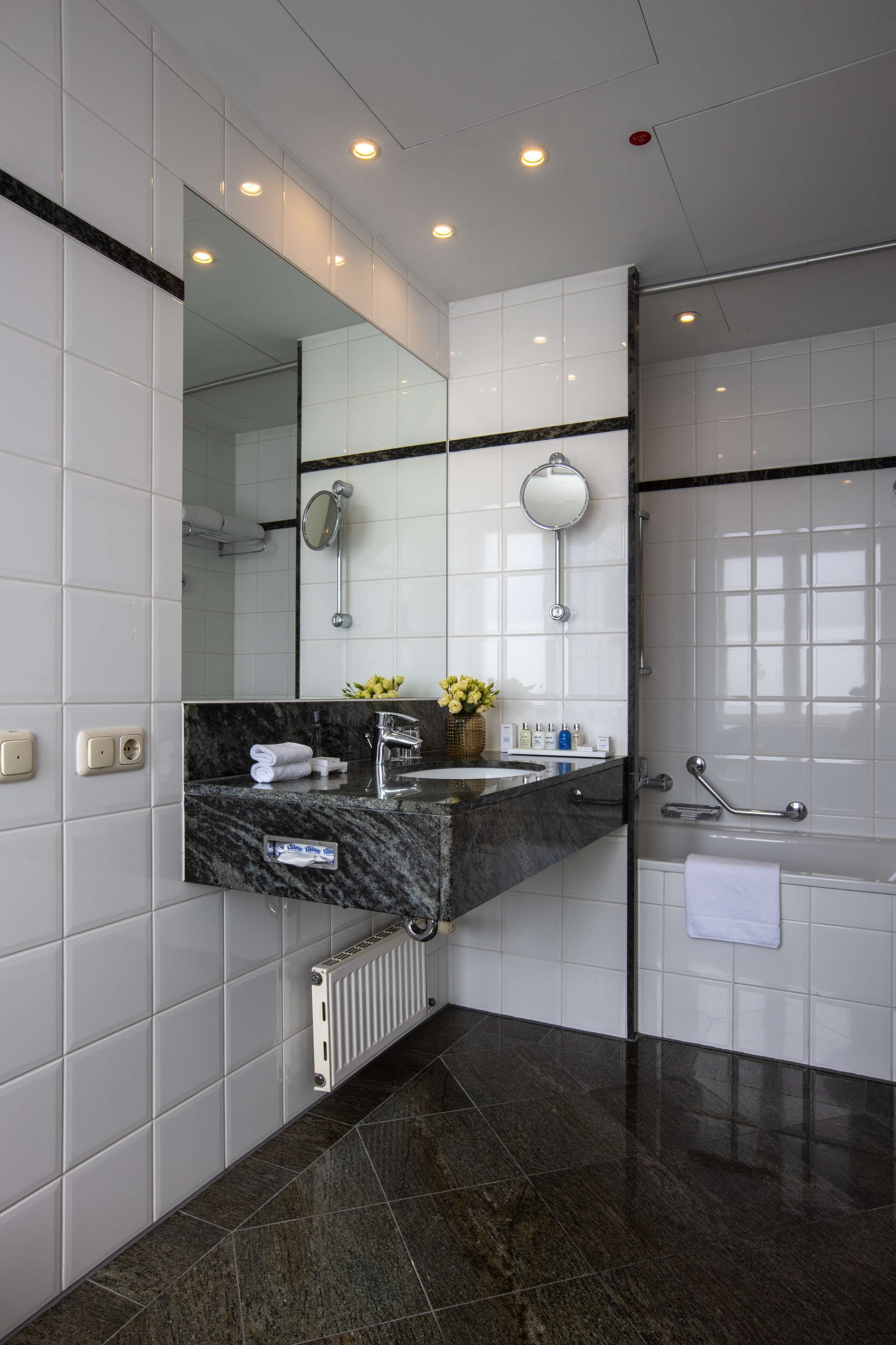 combined shower/bathtub, eco-friendly toiletries, hair dryer, bathrobes