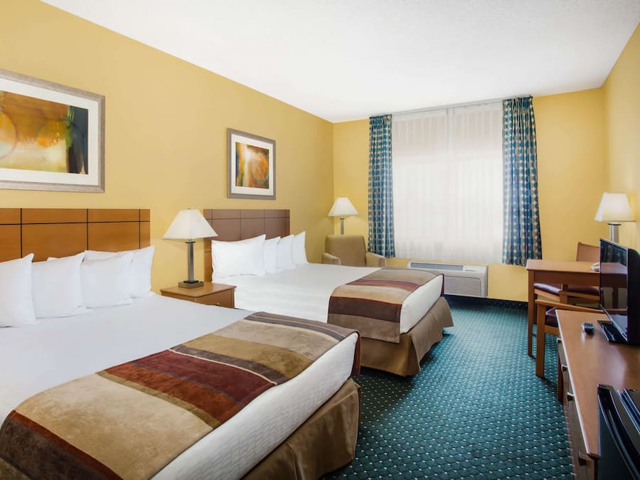 Room, 2 Queen Beds, Non Smoking | In-room safe, desk, laptop workspace, blackout drapes