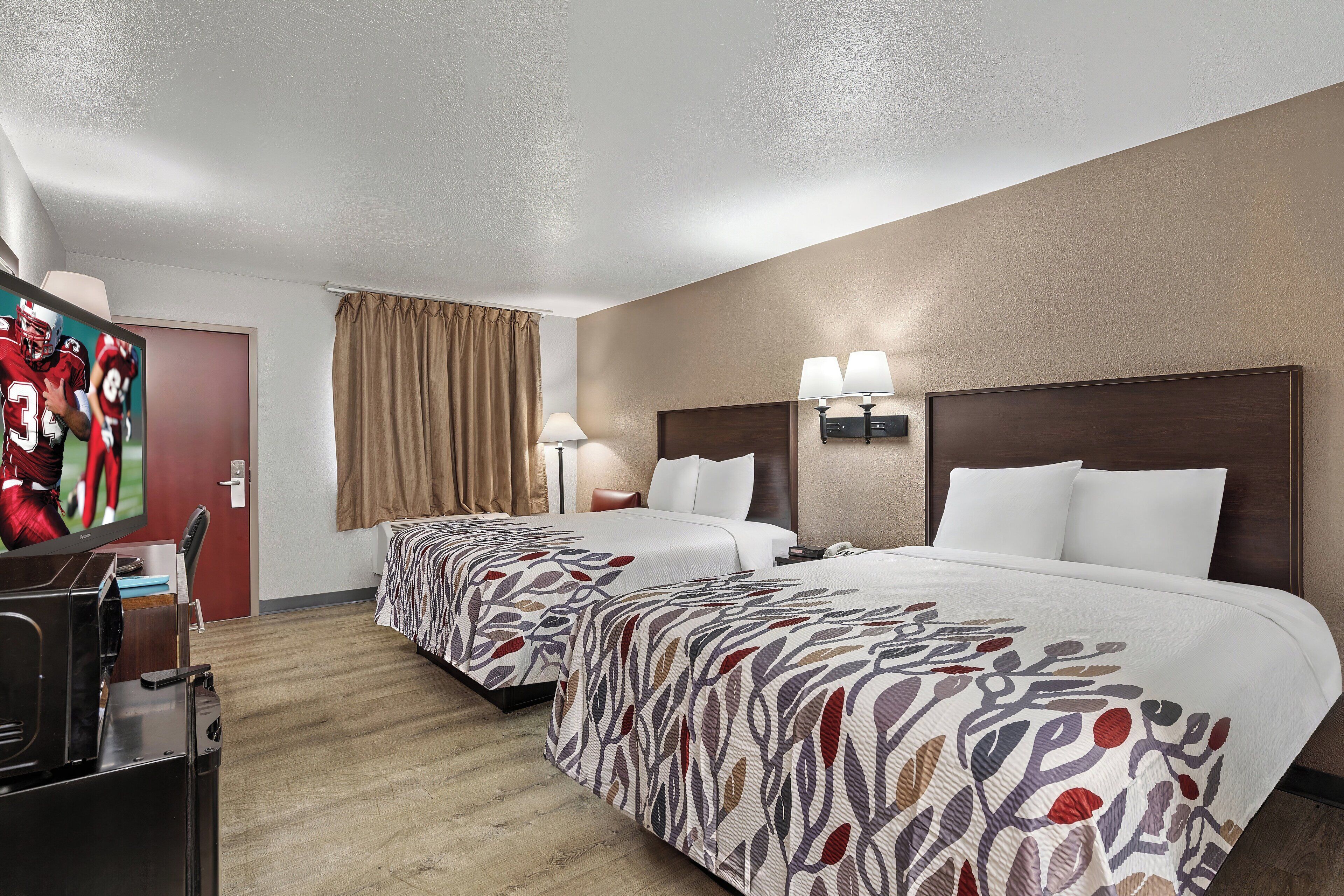 deluxe room, 2 queen beds, non smoking | desk, laptop workspace, blackout curtains, iron/ironing board