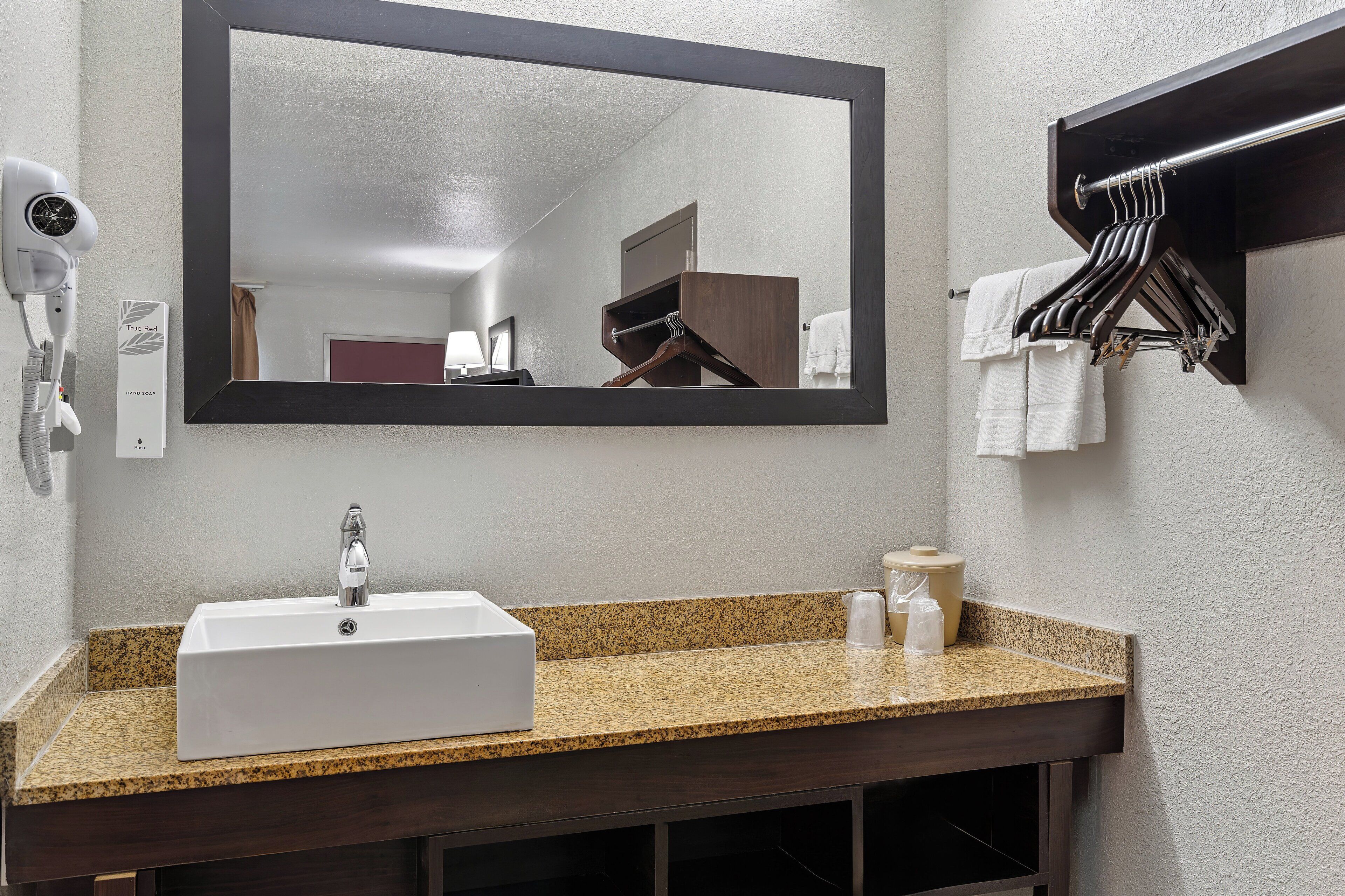 deluxe room, 2 queen beds, non smoking | bathroom | hair dryer, towels, soap, shampoo