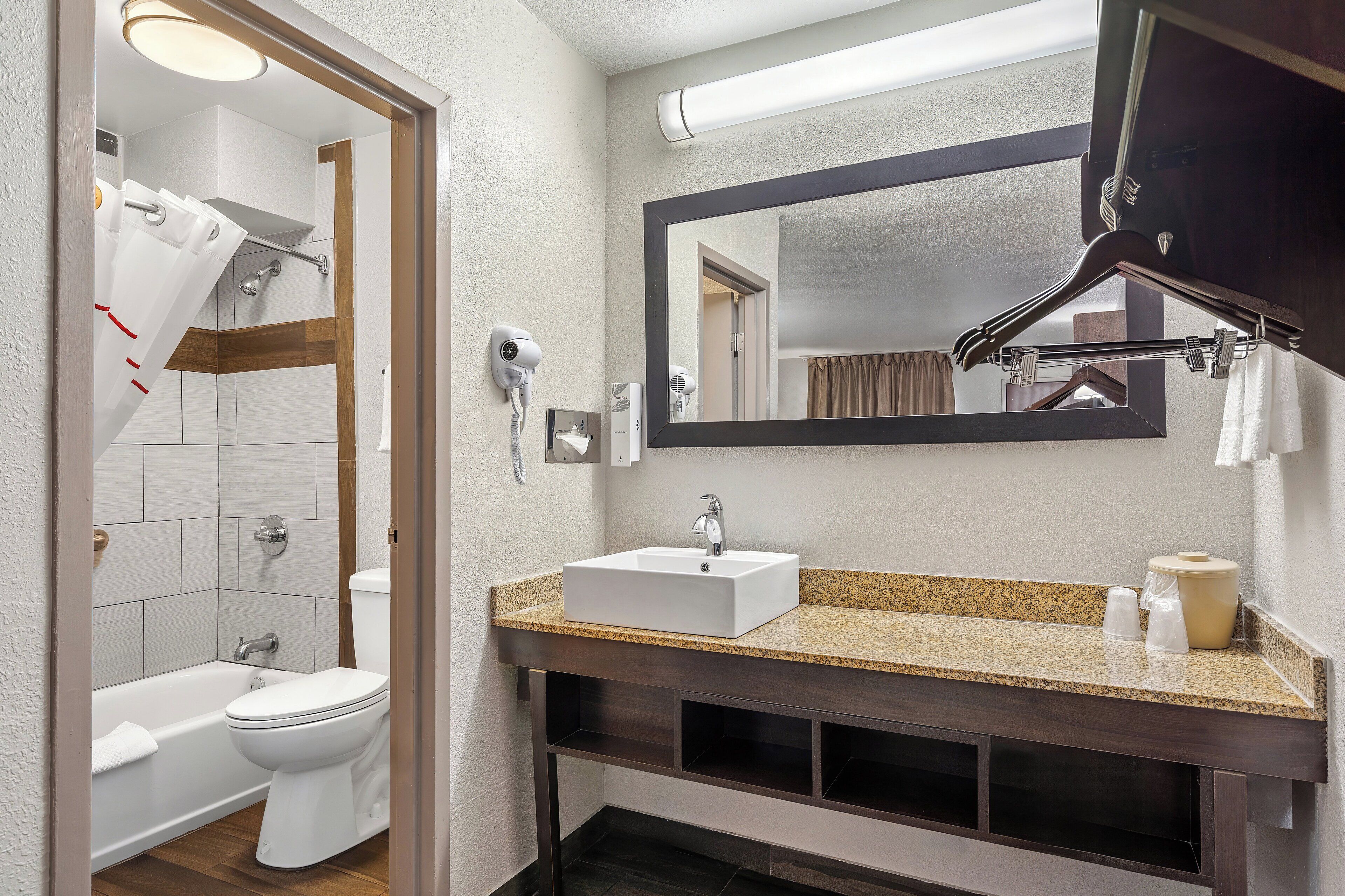 deluxe room, 2 queen beds, non smoking | bathroom | hair dryer, towels, soap, shampoo