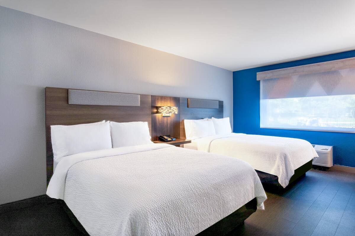 Luxe beddengoed, pillowtop-bedden, een kluis op de kamer, een bureau