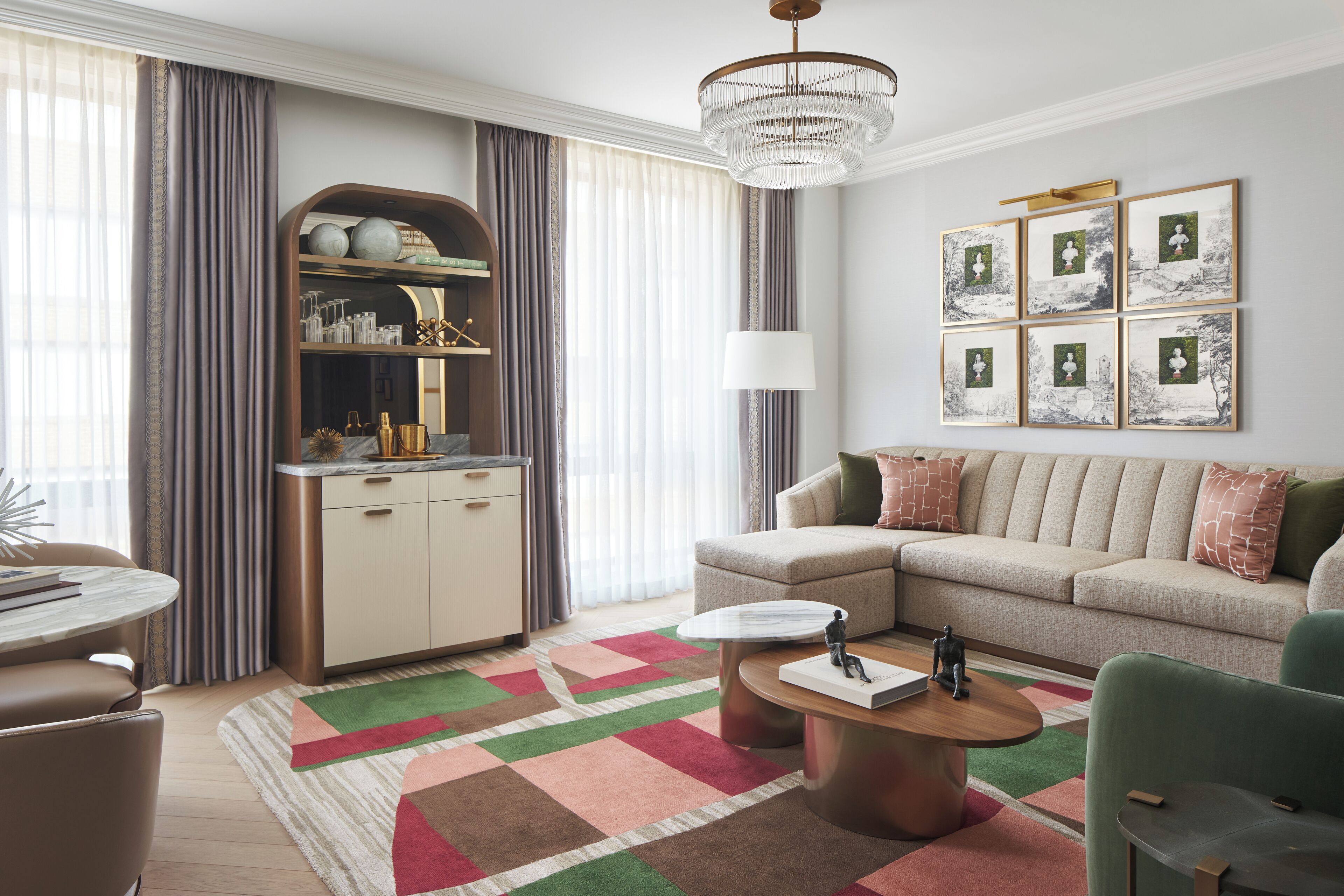 A modern living room with a sofa, coffee table, and a decorative rug.