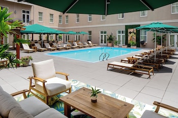Outdoor pool, open 7:00 AM to 10:00 PM, pool umbrellas, sun loungers at Hyatt Centric French Quarter