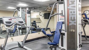 A gym with cardio equipment, weight machines, and mirrors. - Clarion Hotel & Conference Center Ronkonkoma MacArthur Airport (Ronkonkoma)