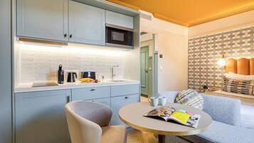 One-Bedroom Executive Apartment | Private kitchen | Mini-fridge, espresso maker, electric kettle