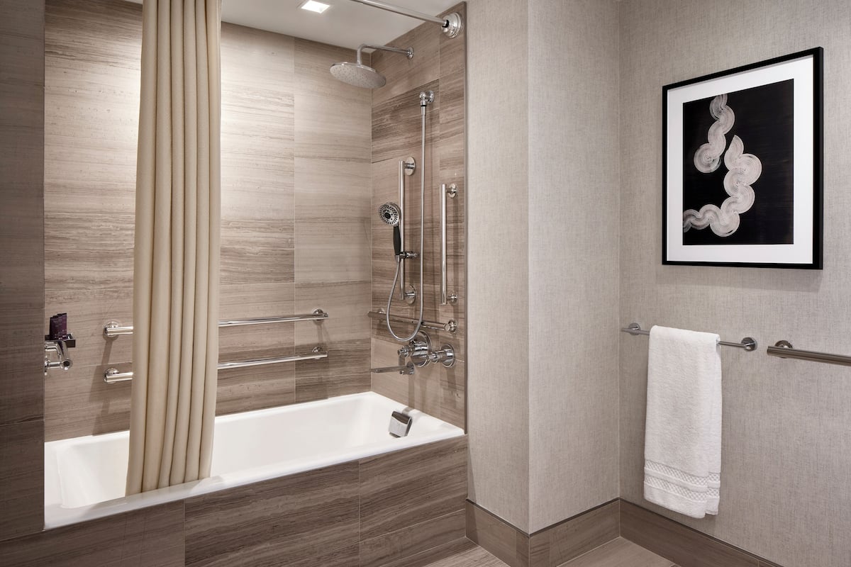 Designer toiletries, hair dryer, bathrobes, slippers