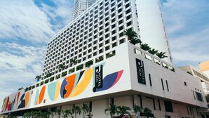 A hotel with a modern design, featuring a prominent logo and a large, multi-story structure. - JEN Penang Georgetown by Shangri-La (George Town)