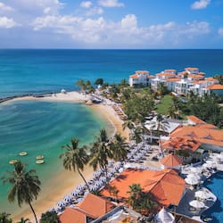 On the beach, white sand, sun-loungers, beach umbrellas