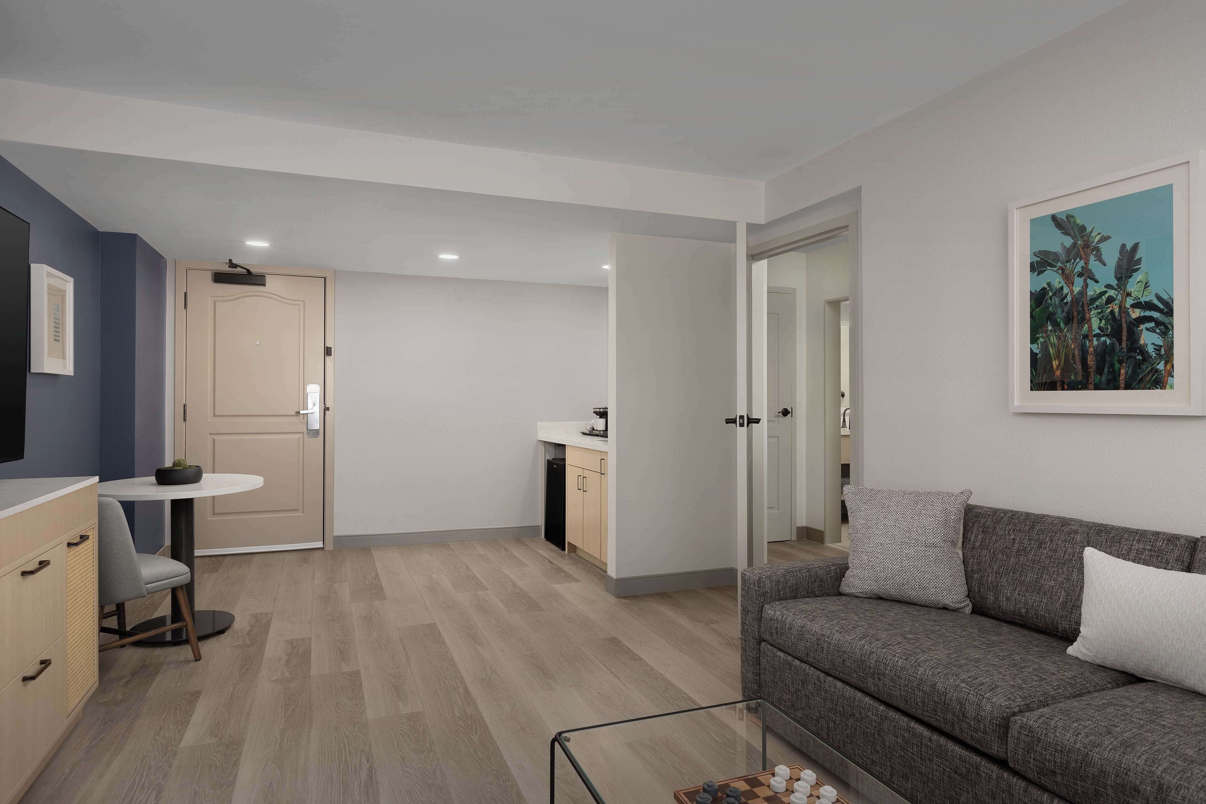 suite, 1 king bed | living area | 55-inch flat-screen tv with satellite channels, tv, ipod dock