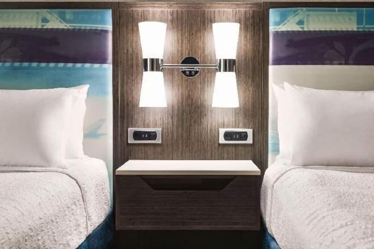 Premium bedding, desk, laptop workspace, blackout curtains