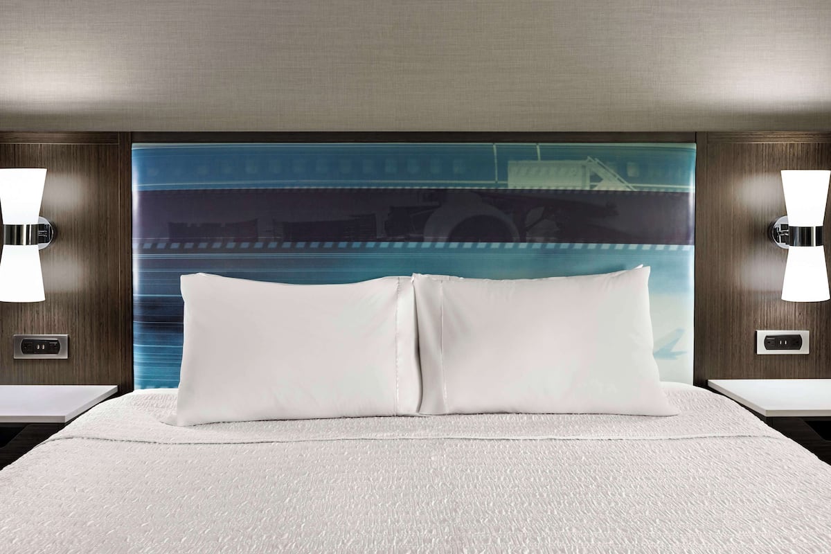 Premium bedding, desk, laptop workspace, blackout curtains