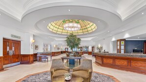 A spacious lobby with a central seating area, a grand chandelier, and a large stained glass ceiling. - The Aberdeen Altens Hotel (Aberdeen)