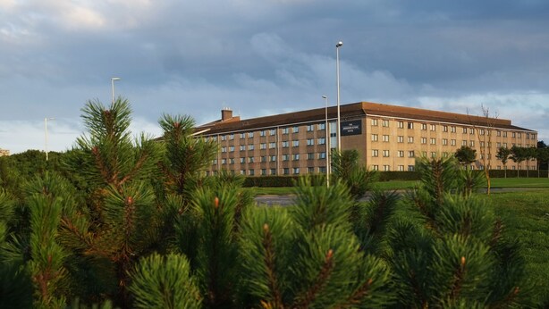 A large, multi-story hotel with a flat roof and a uniform facade, surrounded by a well-maintained lawn and pine trees. - The Aberdeen Altens Hotel (Aberdeen)