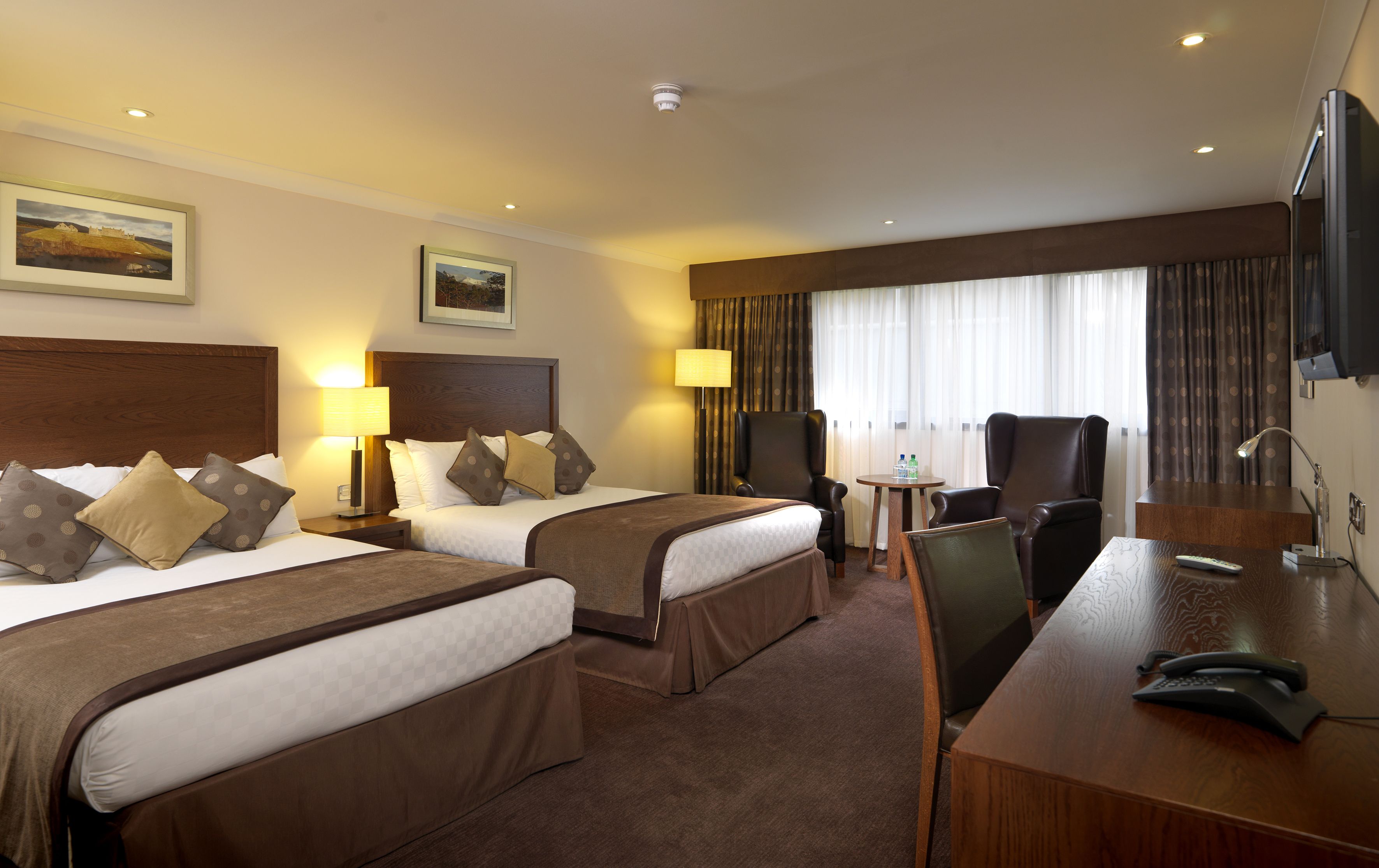 premium quadruple room, 2 double beds | in-room safe, desk, iron/ironing board, free wifi