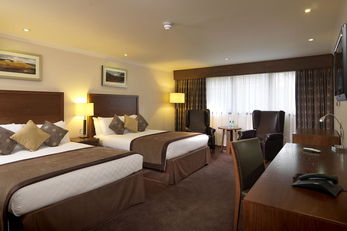 premium quadruple room, 2 double beds | in-room safe, desk, iron/ironing board, free wifi