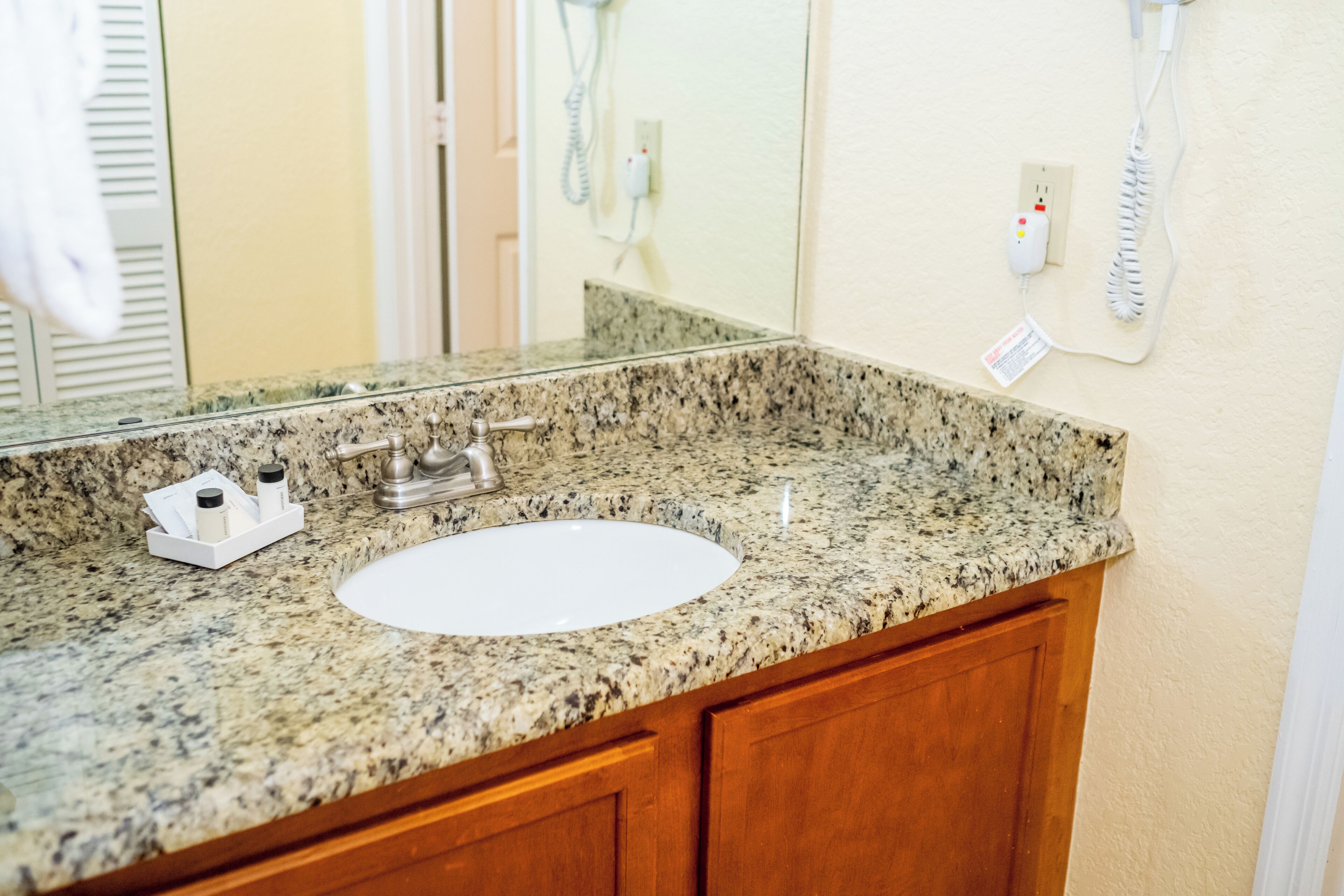 combined shower/bathtub, hair dryer, towels, soap