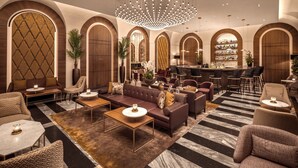 A luxurious lobby with a central seating area, a bar, and a chandelier. - InterContinental Rome Ambasciatori Palace by IHG (Rome)