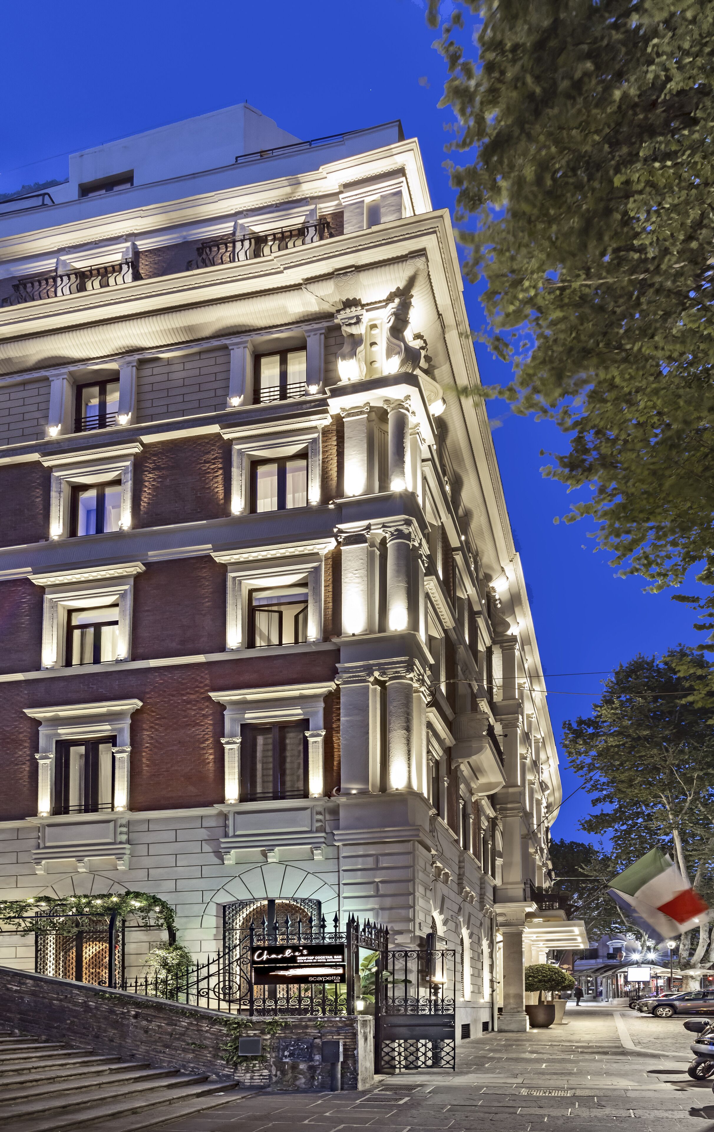 A multi-story building with a classic architectural style, featuring ornate detailing and large windows.