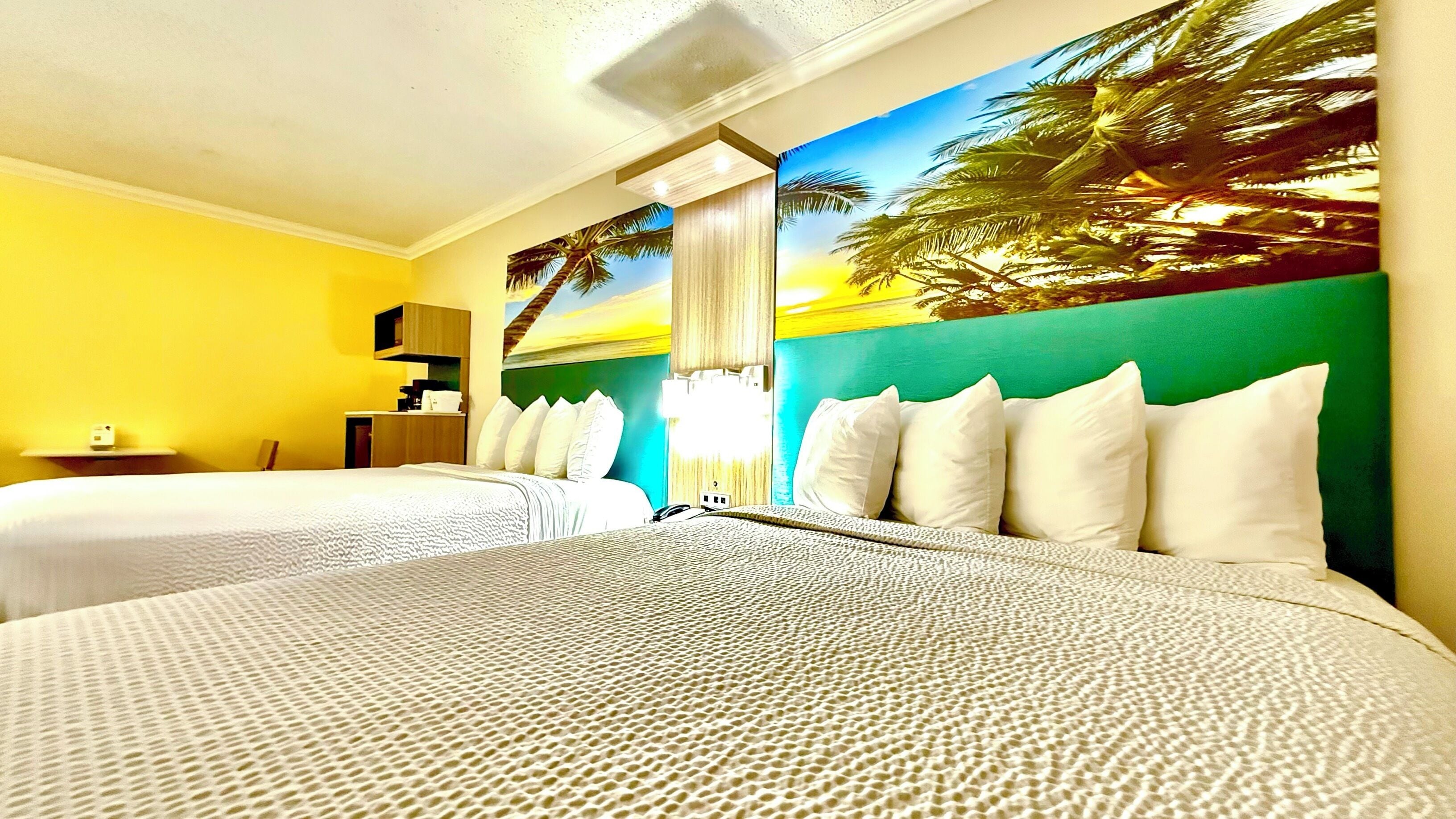 Ropa de cama de alta calidad y caja de seguridad en la habitación 