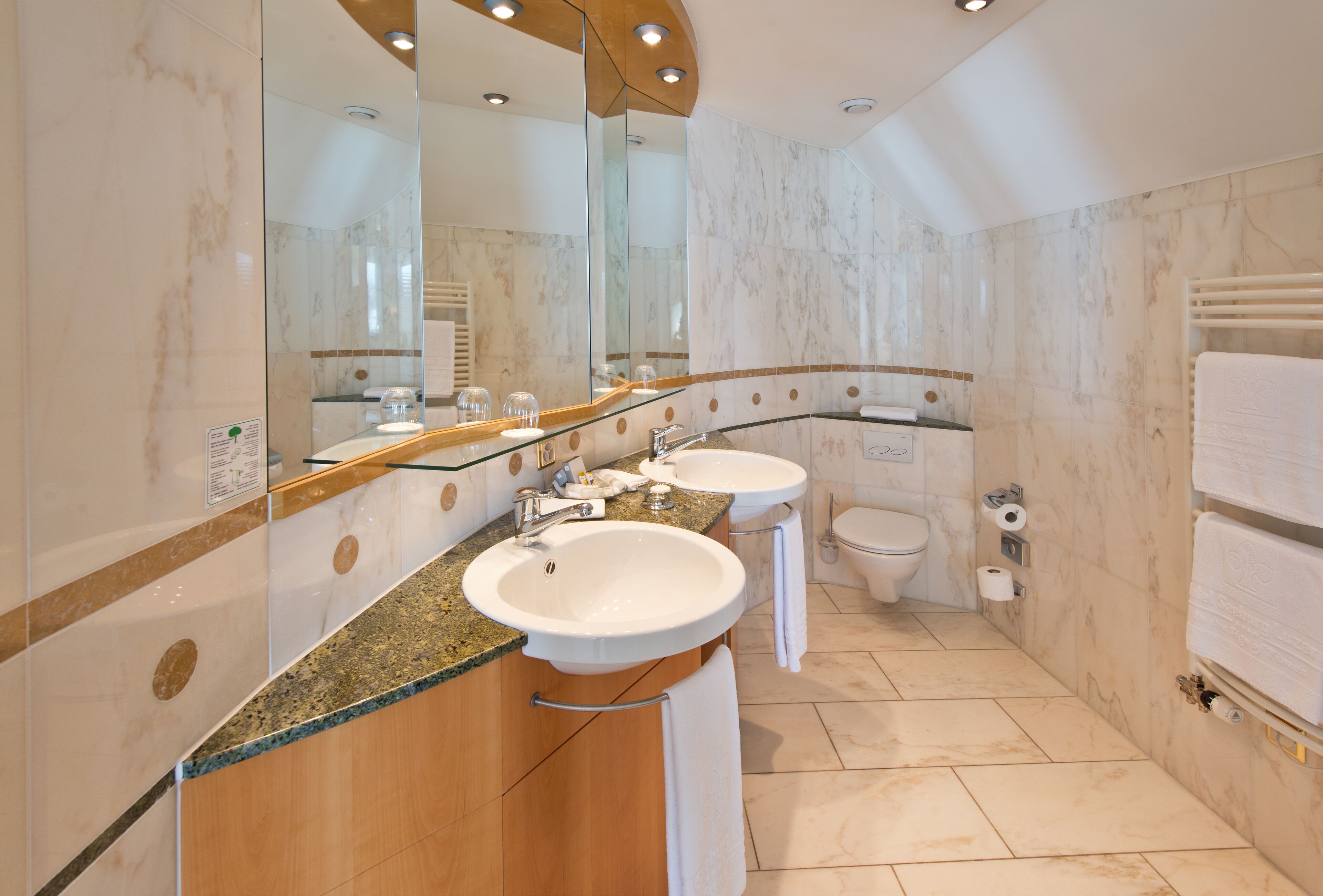 deluxe double or twin room | bathroom | eco-friendly toiletries, hair dryer, towels