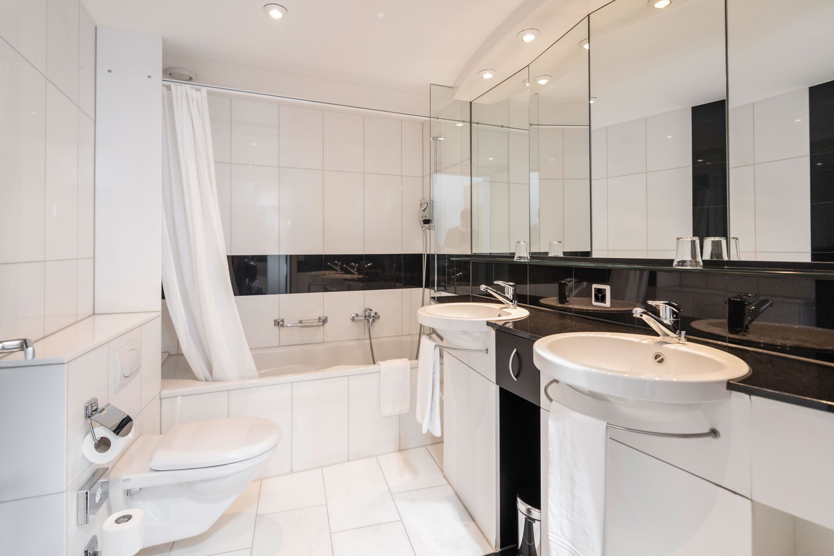 deluxe double or twin room | bathroom | eco-friendly toiletries, hair dryer, towels