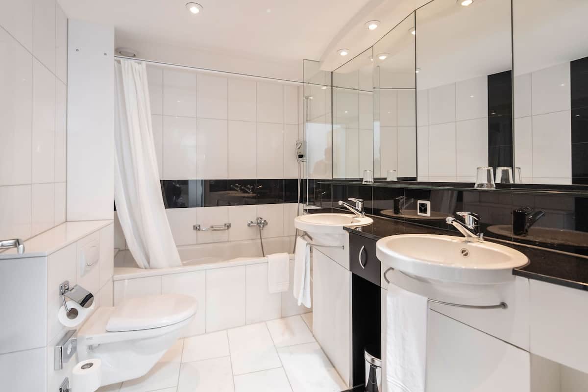 deluxe double or twin room | bathroom | eco-friendly toiletries, hair dryer, towels