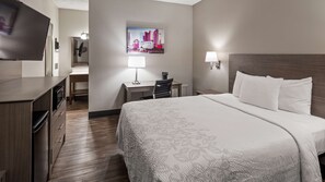 A hotel room with a bed, desk, chair, and a television. - SureStay Hotel by Best Western Findlay (Findlay)