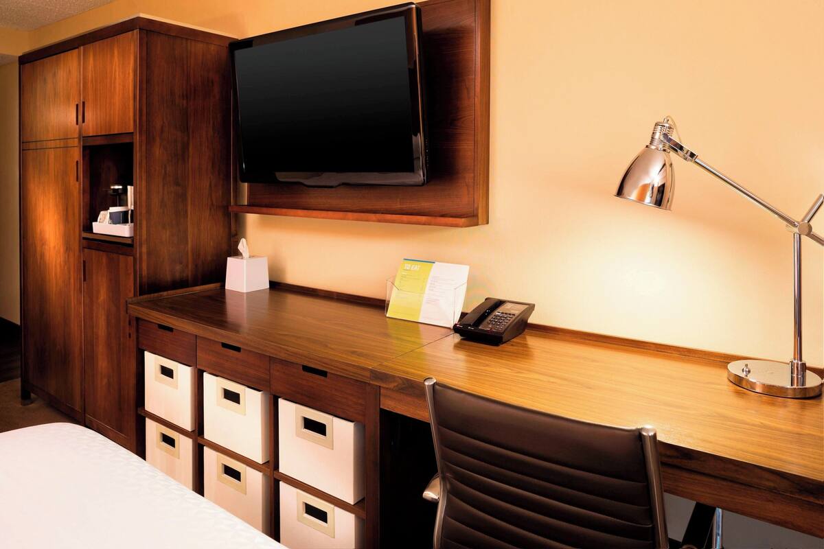 Down comforters, desk, blackout drapes, iron/ironing board