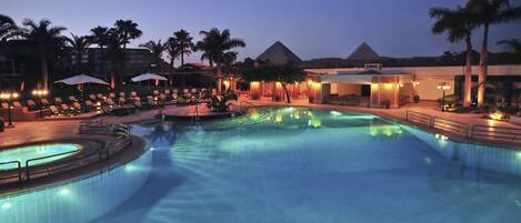 Indoor pool, outdoor pool, pool umbrellas, lifeguards on site