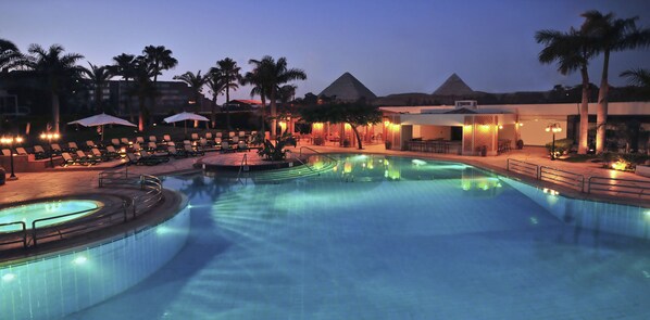 Indoor pool, outdoor pool, pool umbrellas, lifeguards on site