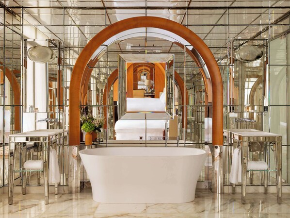 Separate tub and shower, rainfall showerhead, eco-friendly toiletries