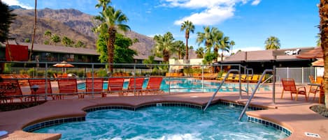 A heated pool, open 8:00 AM to midnight, pool loungers