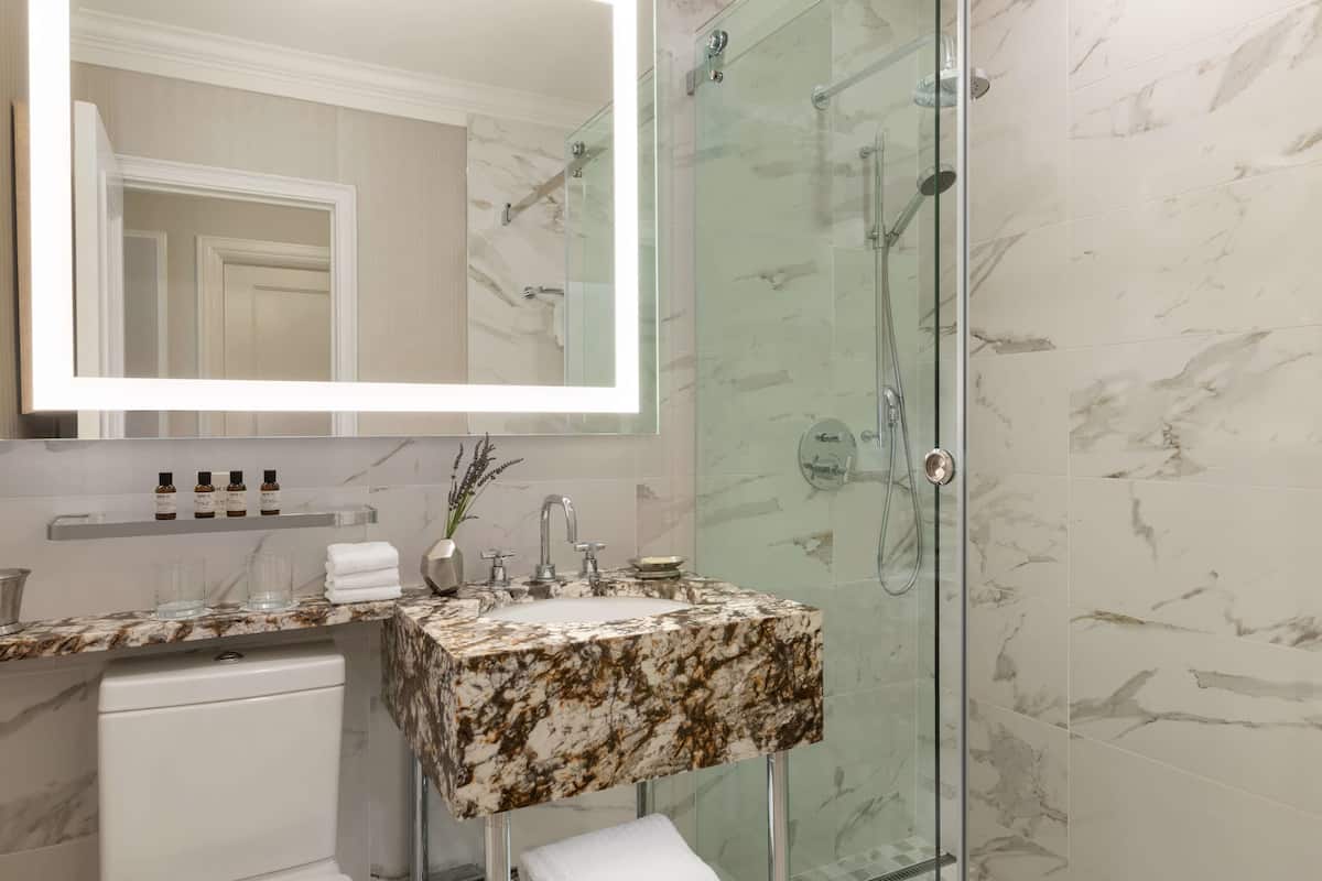 Combined shower/tub, designer toiletries, hair dryer, bathrobes
