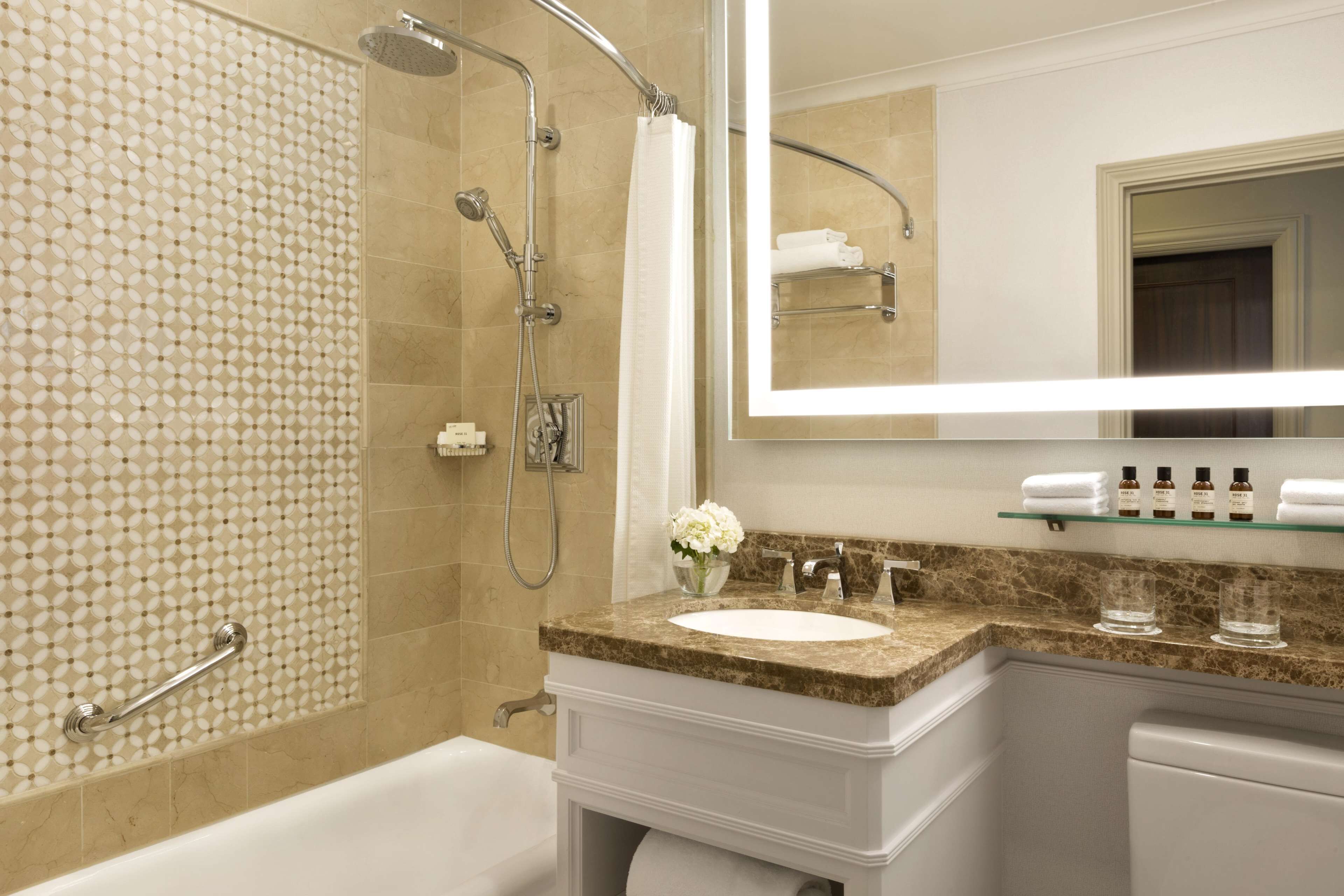 combined shower/bathtub, designer toiletries, hair dryer, bathrobes